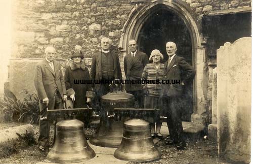 A bell cast in memory of Alan Gates Sandford. His parents are on the left in the picture. The bell hangs in St Peter and St Paul, Milton-next-Gravesend.
